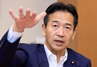 　インタビューに答える公明党の岡本三成代表